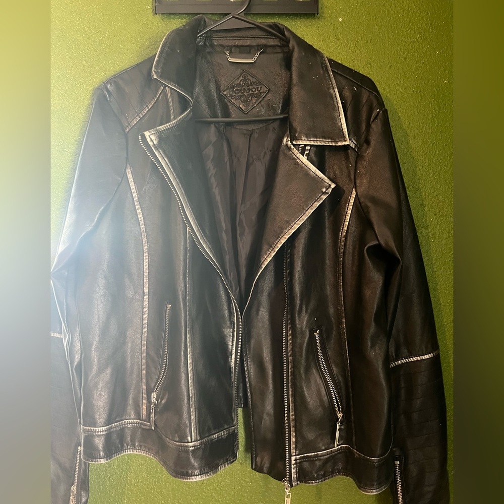 Black Leather Jacket with Silver Edge Details.
